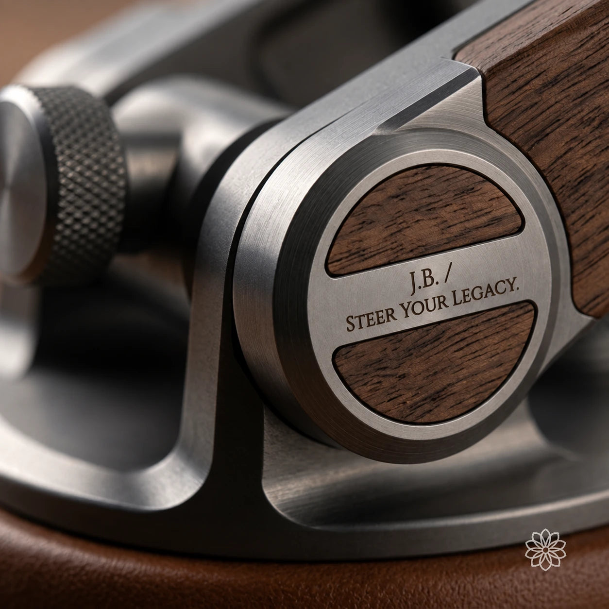 Close detail of brushed metal, figured wood, and a personal engraved dedication.