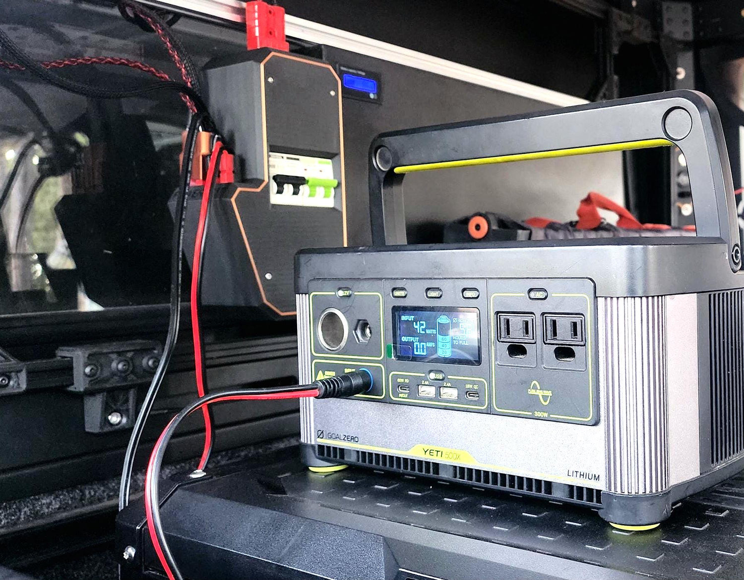 DC power system wired for off-grid field use with portable battery, camp tools, and modular adapters