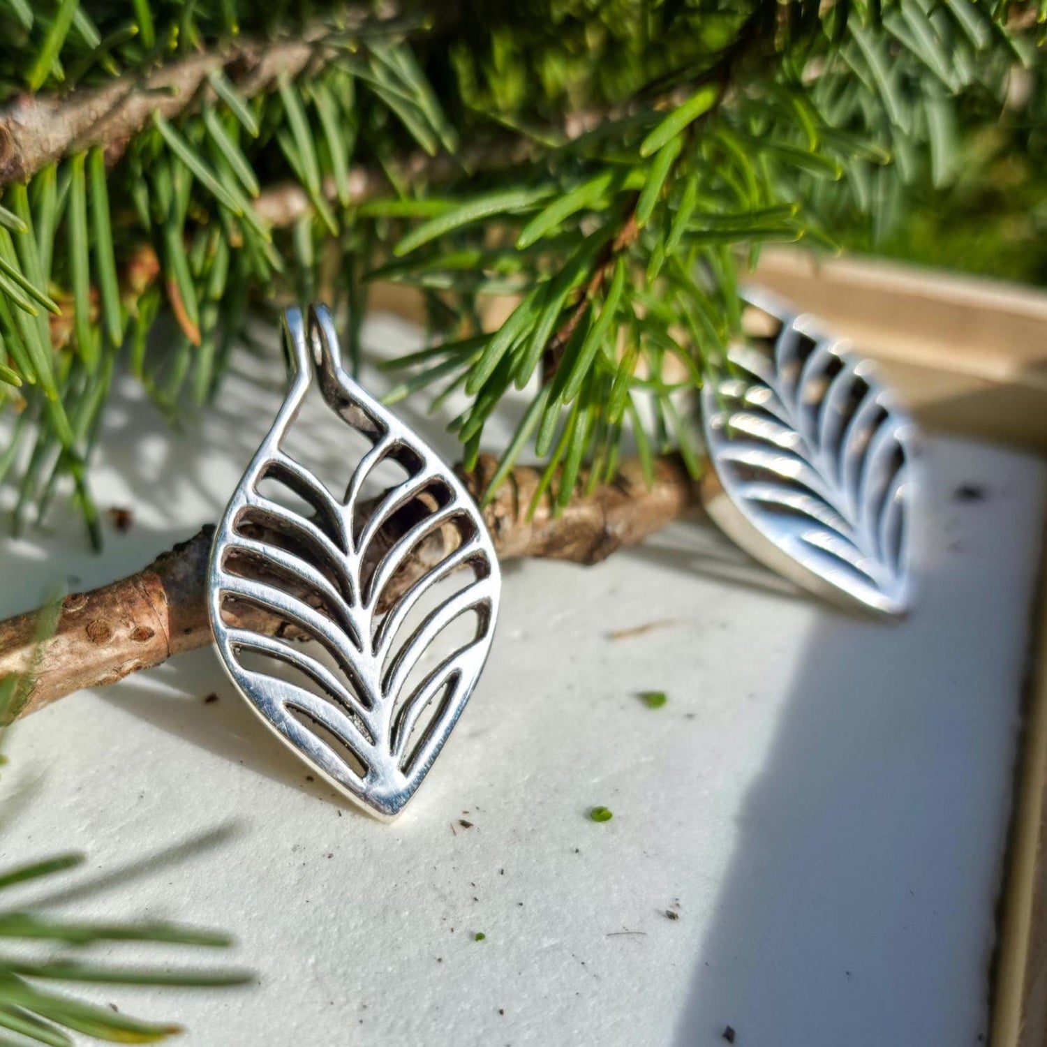 Handmade leaf pendant by Aetherium Innovations, cast in silver using in-house tools