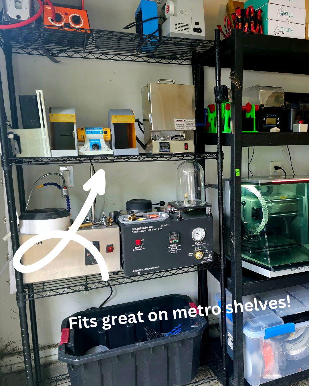 Photo of a workshop with multiple compact tools organized on metal metro-style shelving. A white arrow points to the Cut ’n Cab MakerSpace Edition on a middle shelf, demonstrating its compact footprint and compatibility with standard tool storage solutions.