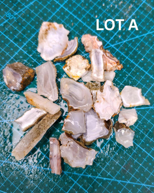 image features a photo of banded chalcedony, light agates, drusy quartz and botryoidal chalcedony & quartz. the image is a close up shot of one of the bundle parcel lots available for purchase in the listing.