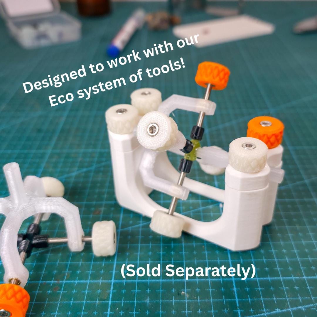 Showing the Aetherium lapidary tools highlighting that this is part of a larger system of tools, illustrating compatibility within a modular ecosystem. The tray supports organized stone handling while working with faceting jigs, cabbing tools, and polishing equipment, reinforcing a system-based workshop layout.