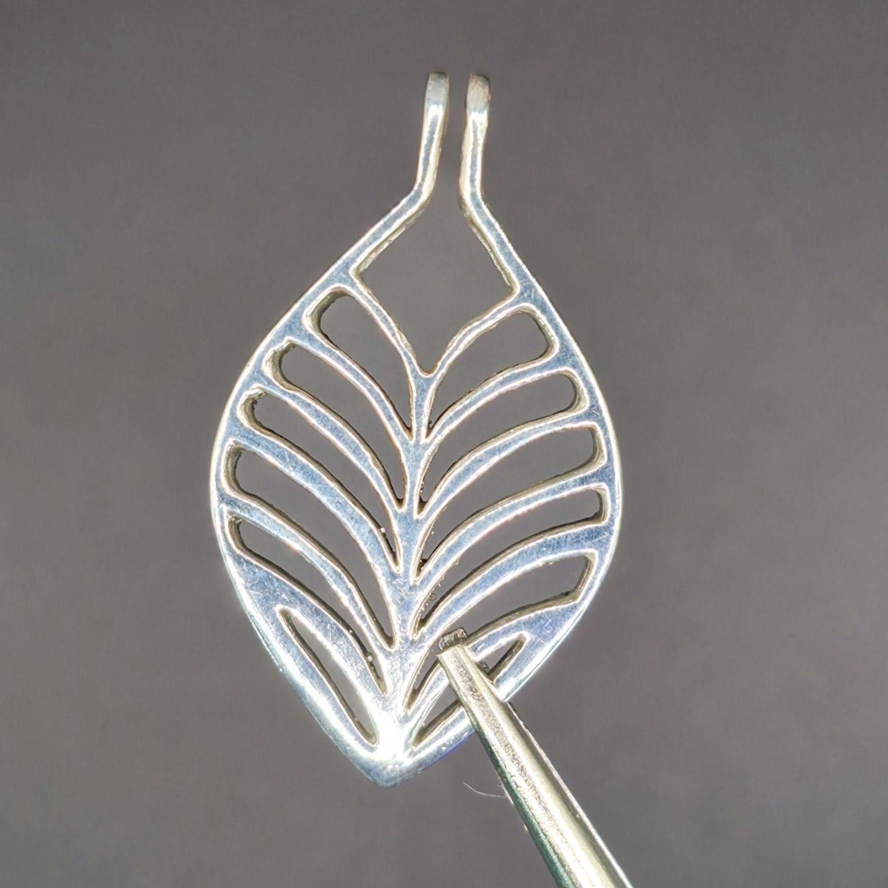 High polished silver examiners view front.