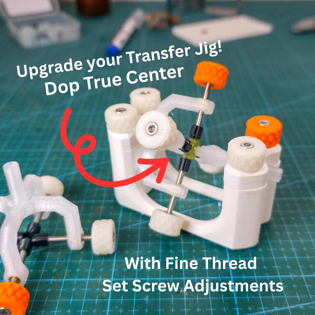 Close-up of Gem Axis V3 in use with a transfer jig, showing the fine-thread set screws and glow-in-the-dark knobs. Tool designed for aligning gemstones on 6mm dops, improving true center placement and consistency in lapidary faceting workflows.