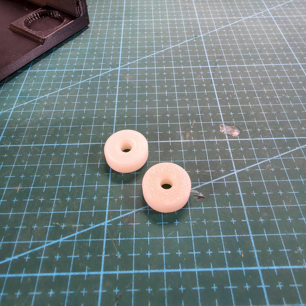 close up shot of the saw table adapters for the makerspace edition cut n cab. This allows the saw to stay level and stable with the addition of the quick clamp. Will require the addition of m3 screws as the factory screws are not long enough. (sold seperately)