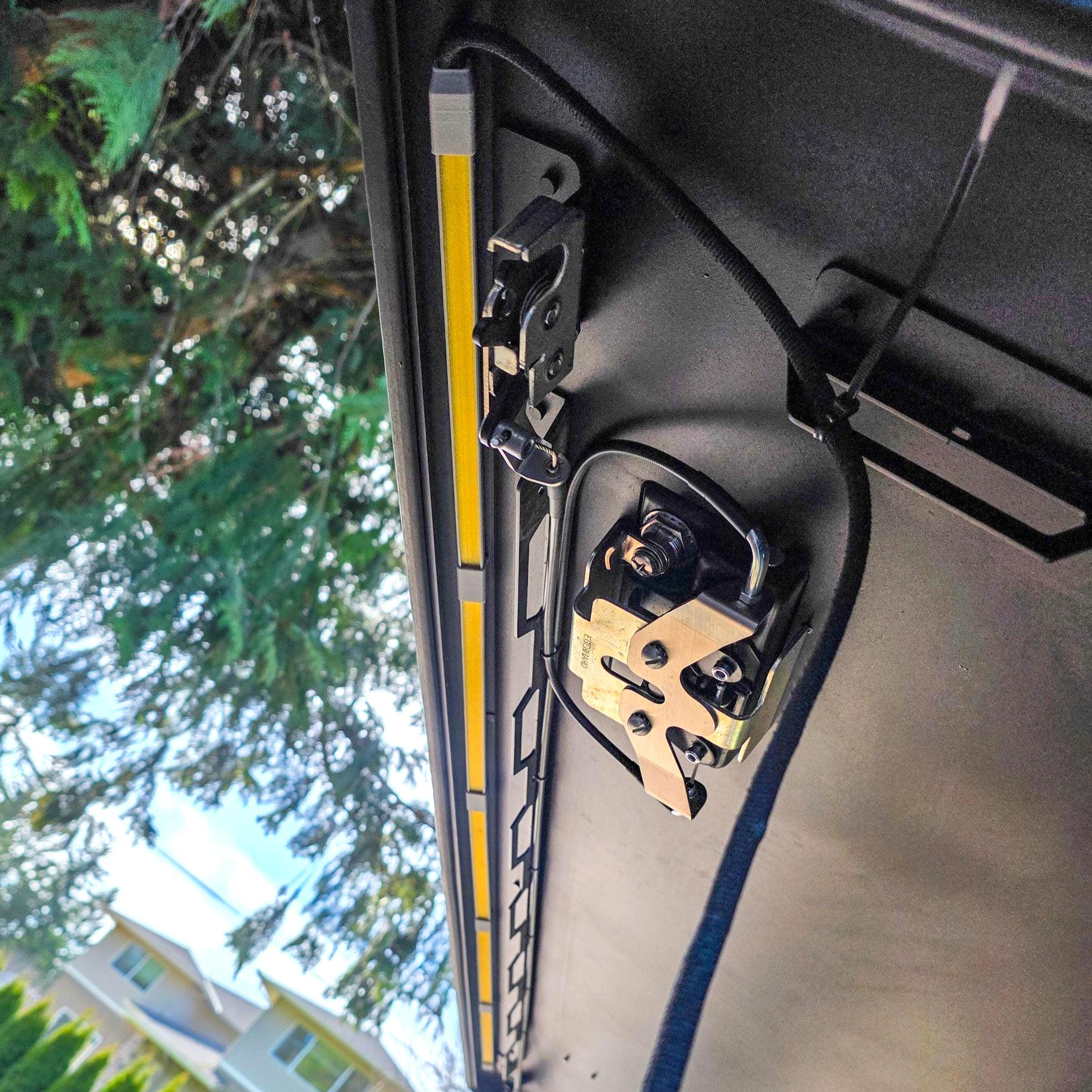 image features a led bar light on a camper door featuring amber bug resistant lenses and zip tied wires for cable management