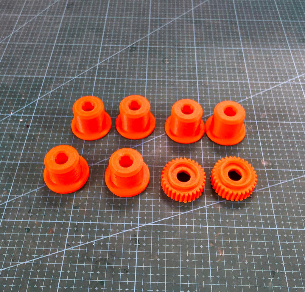 Image features high vis colored wheel spacer adapters and nut screws printed out of GF-ABS on a cut resistant mat. Highlighting the intended use to be installed in the abrasive wheels of your choosing.