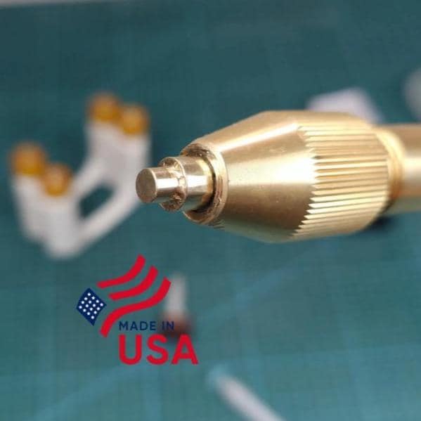 Image features a brass faceting quill holding a precision CNC brass lapidary dop stick designed to facet uncut gemstones into beads. The image features the "made in USA" logo showing pride of craftsmanship.