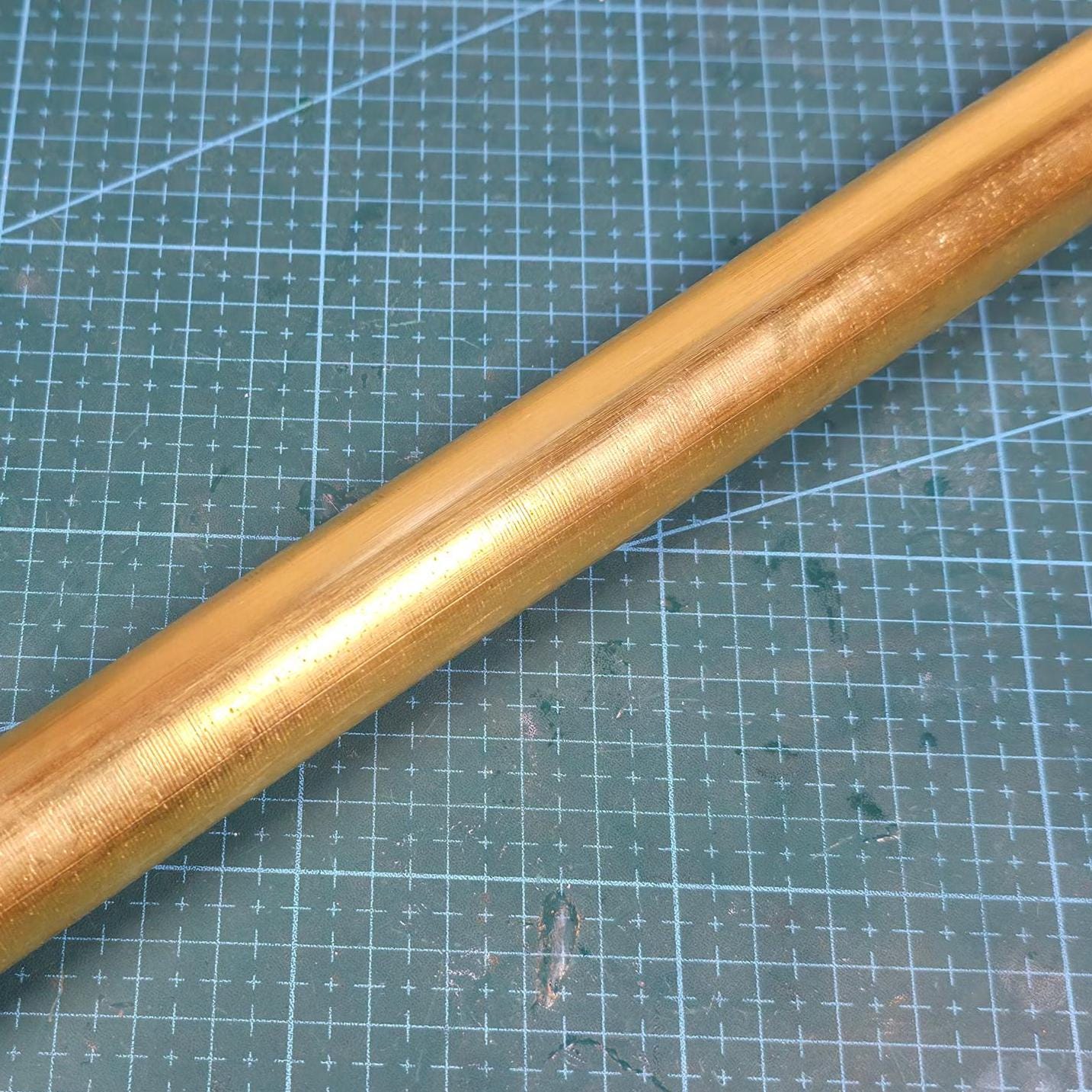 mid section of brass round stock 300mm in length