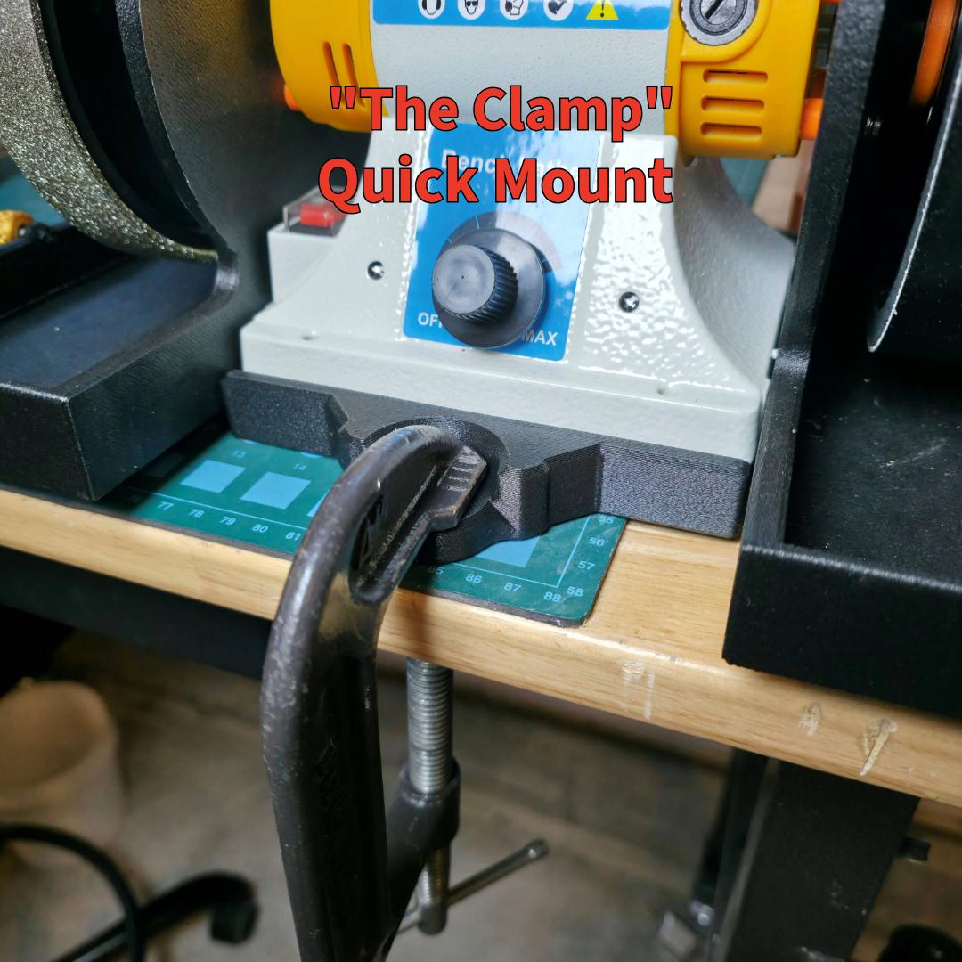 Close-up of the “Quick Mount” bench clamp securing the MakerSpace Edition machine to a wooden workbench. The black C-clamp locks into a precision-milled mount under the lathe, providing stable, vibration-free operation while allowing fast installation or removal for portable setups.
