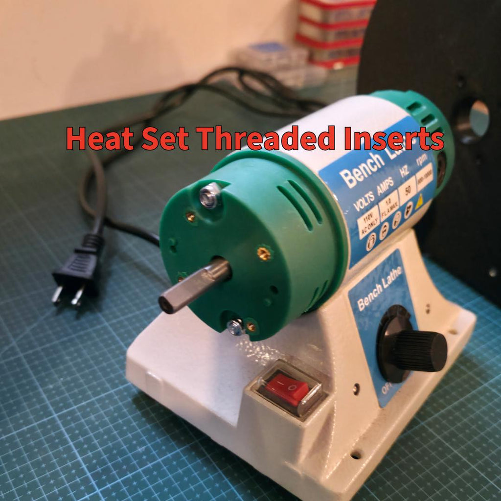 Photo of the MakerSpace Edition’s bench lathe motor with green end caps showing heat-set brass threaded inserts. These inserts reinforce mechanical connections for repeated assembly and disassembly, ensuring modular durability and alignment across multiple tool attachments.