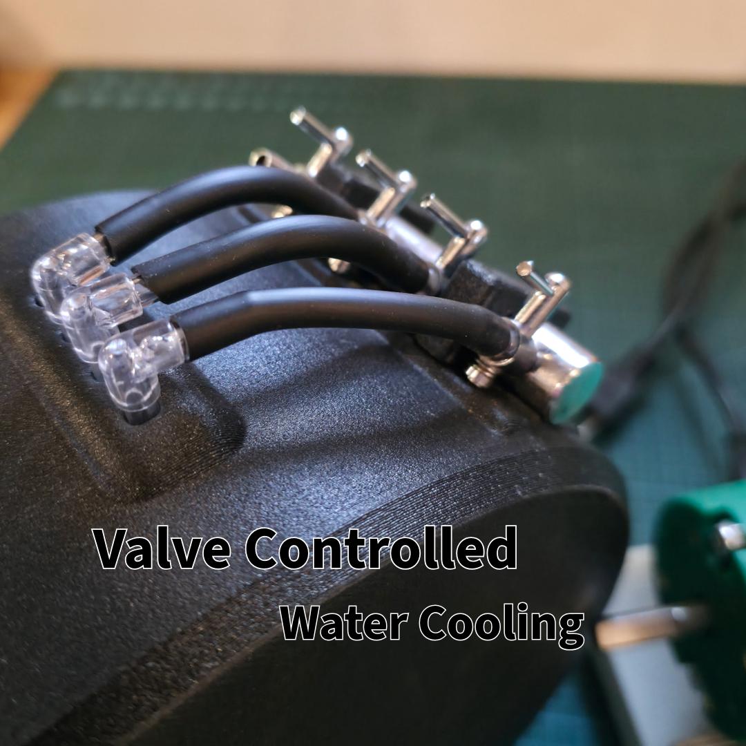 Macro shot of the valve-controlled water system on the machine’s housing. Four adjustable flow valves connect to flexible tubing, allowing independent water regulation across abrasive wheels or cutting areas. Designed for precise coolant control and clean operation during extended grinding sessions.
