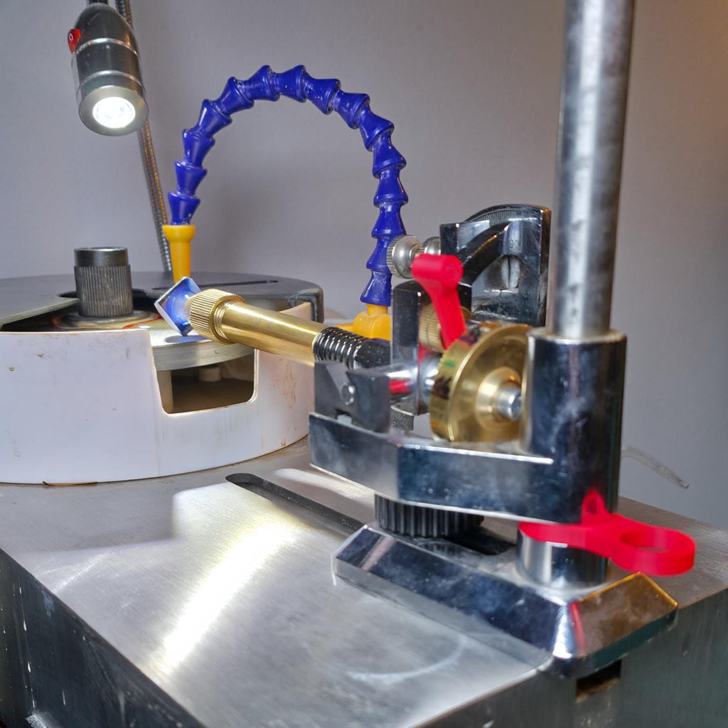 Image features the vevor faceting machine outfitted with the aetherium lapidary ecosystem. Free spin adapter, mast leveling spacers, and splash lid.