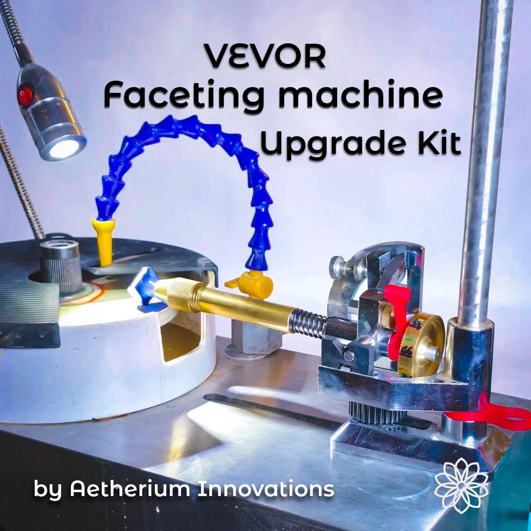 Vevor faceting machine shown in use with multiple aftermarket upgrades installed, including a splash lid, water baffle shield, free spin adapter, knurled controls, and lapidary accessories. On-image text reads “VEVOR Faceting machine Upgrade Kit” and “by Aetherium Innovations.” The image shows a gemstone mounted on a dop stick approaching the lap under focused lighting, emphasizing a complete faceting machine upgrade system rather than a single part.