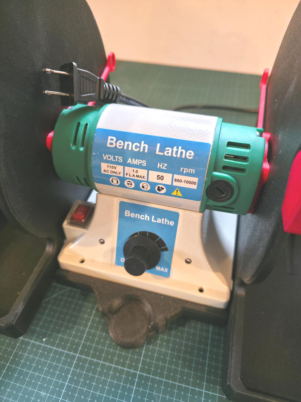 Bench lathe installed on the Quick Clamp Adapter base, showing tight alignment and support under both housing feet for secure operation.
