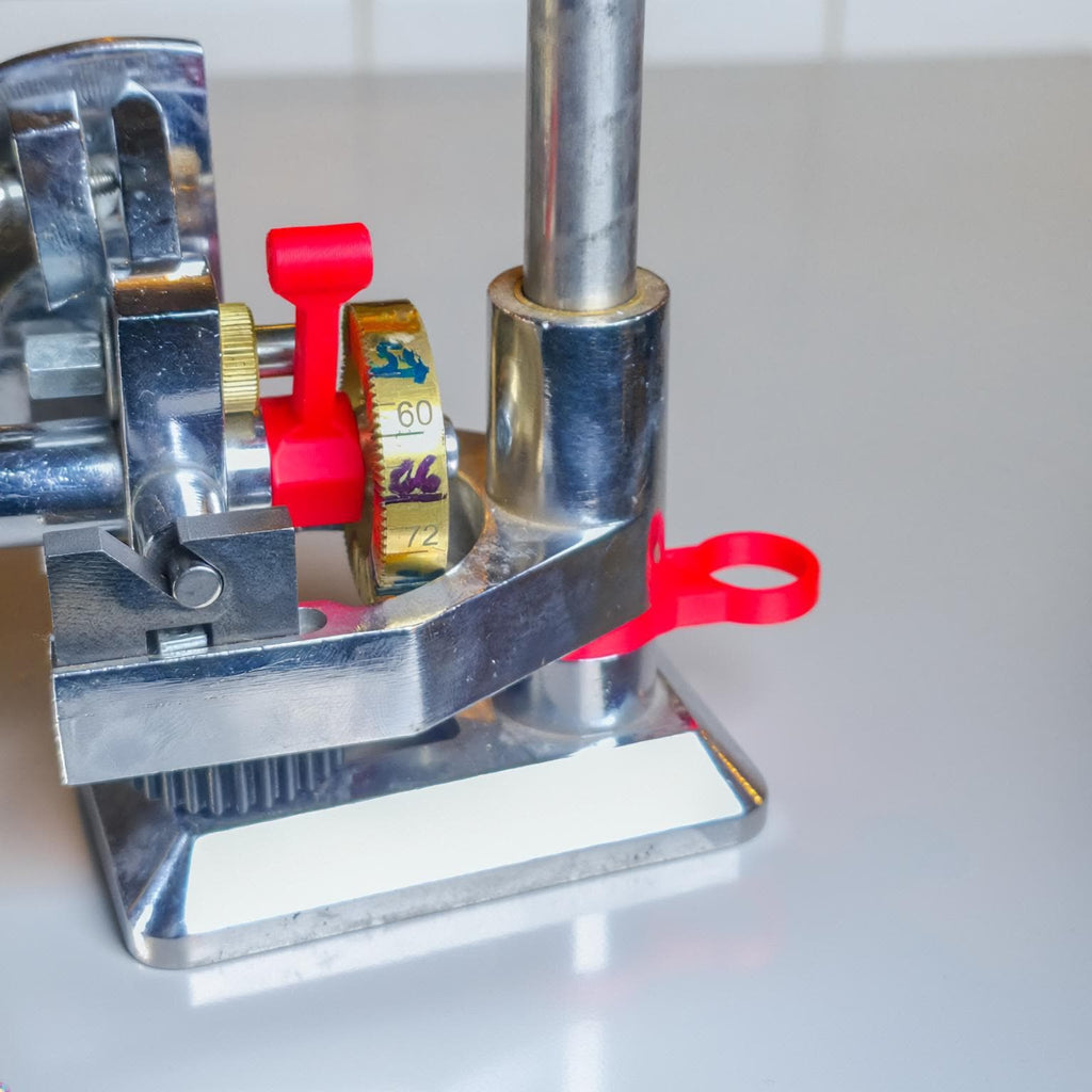 A labratory table photo of the mast leveling spacers and free spin adapter offered in the aetherium innovations lapidary ecosystem.
