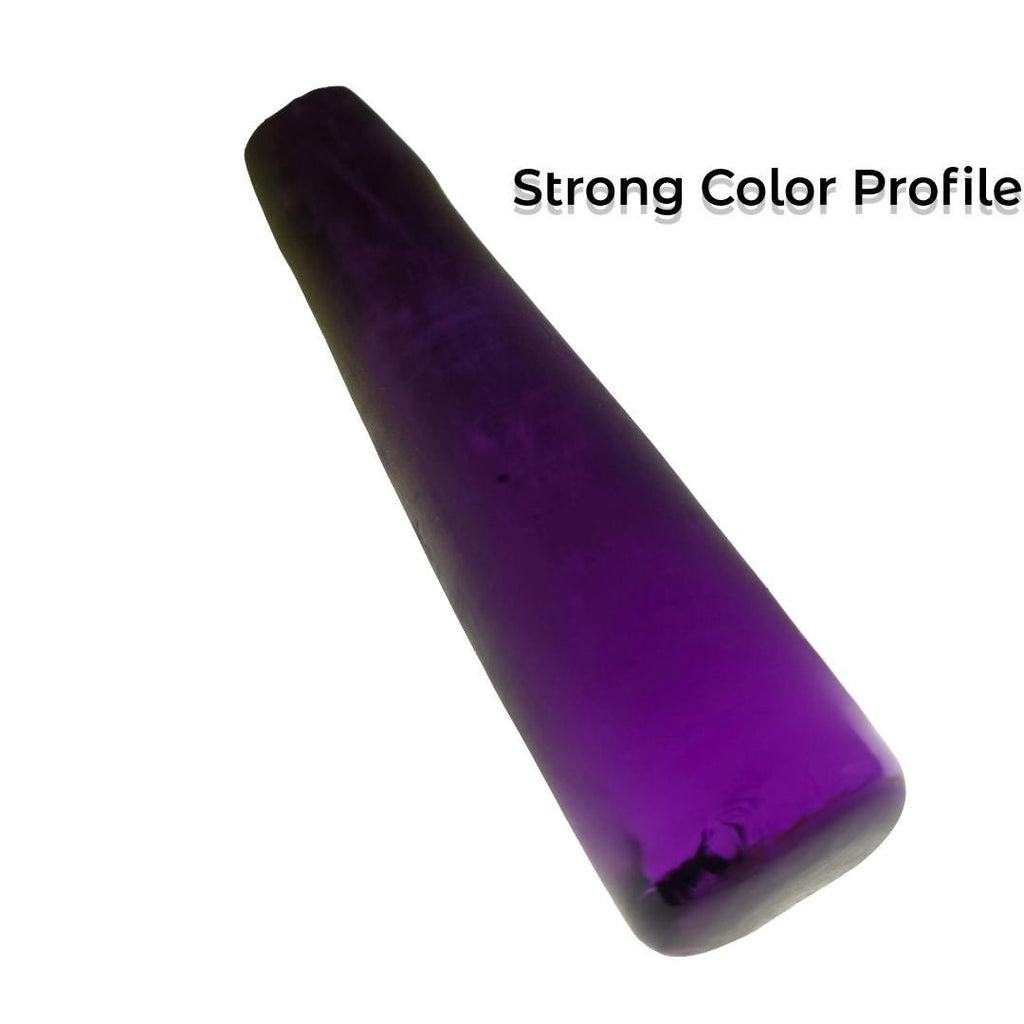 Aetherium Alexandrite crystal with deep violet body color and tapered shape, demonstrating exceptional hue consistency and saturation. Synthetic color-change gemstone rough suitable for high-end jewelry design and precision gem cutting.