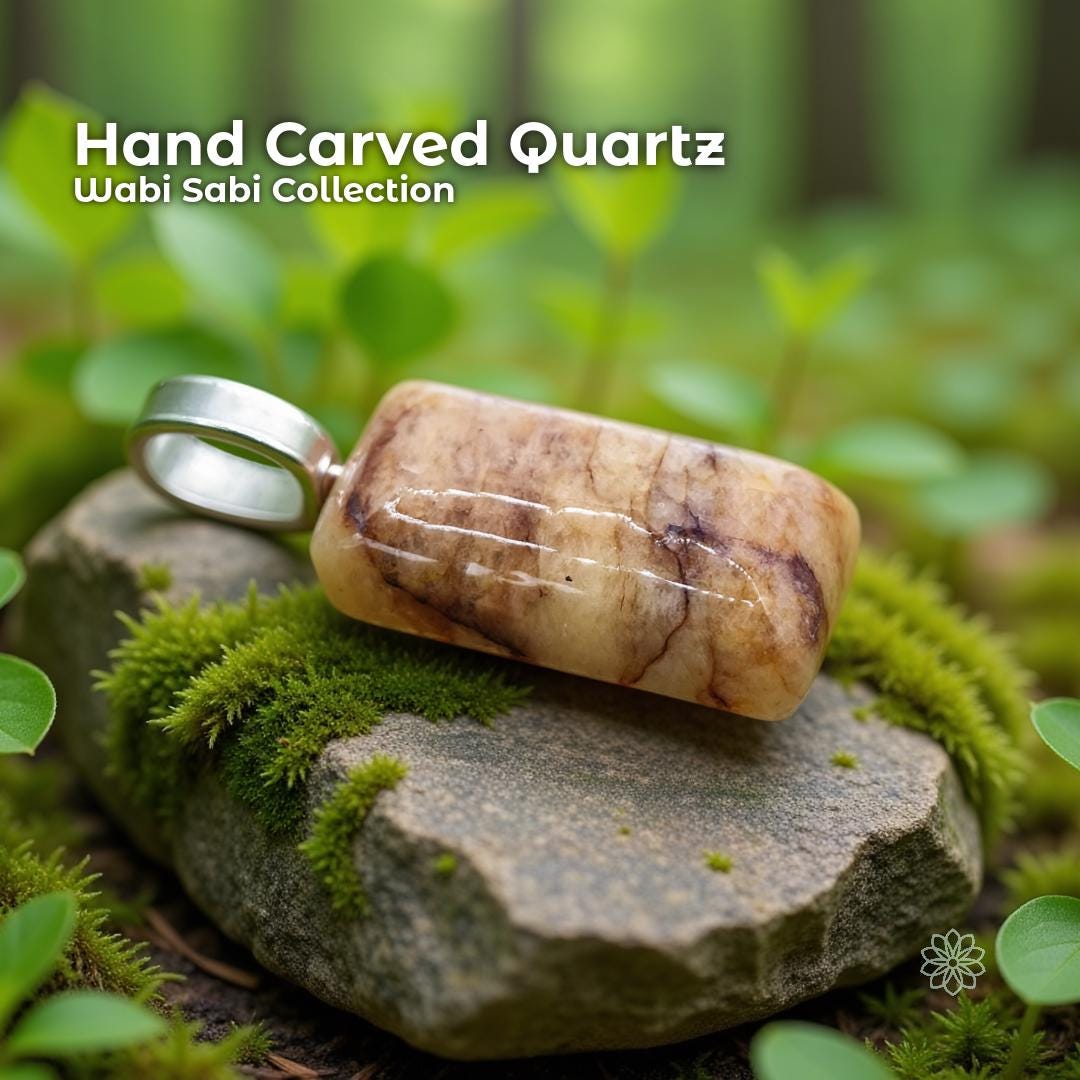 A hand-carved orange aventurine quartz pendant set in a sterling silver bail, resting on a moss-covered stone in a forest setting. The quartz is a polished rectangular shape with warm orange, cream, and subtle marbled patterns. Text on the image reads “Hand Carved Quartz – Wabi Sabi Collection,” with a small Aetherium floral mark in the lower right corner.