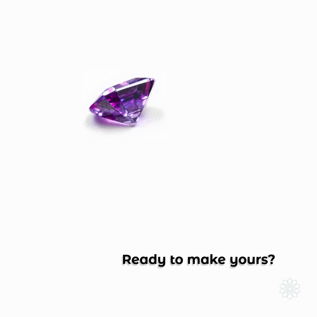 Loose faceted purple gemstone set against a white background, symbolizing the start of a custom jewelry project. Represents gemstone selection, personalized design, and the transformation from raw idea to finished heirloom. Encourages clients to begin their bespoke jewelry experience.