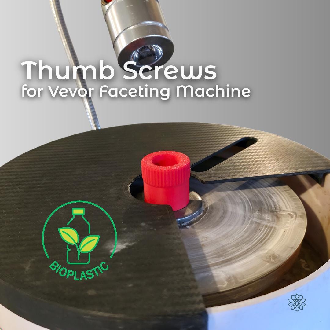 “Close-up of a Vevor faceting machine with a red knurled quick-change thumb screw installed on the lap spindle. The carbon-fiber splash pan is partially opened, showing the polishing lap beneath. The upgraded thumb screw replaces the factory steel nut, allowing tool-free lap changes and faster workflow during gem faceting, mast alignment, and lap swaps. Made from ecofriendly materials”