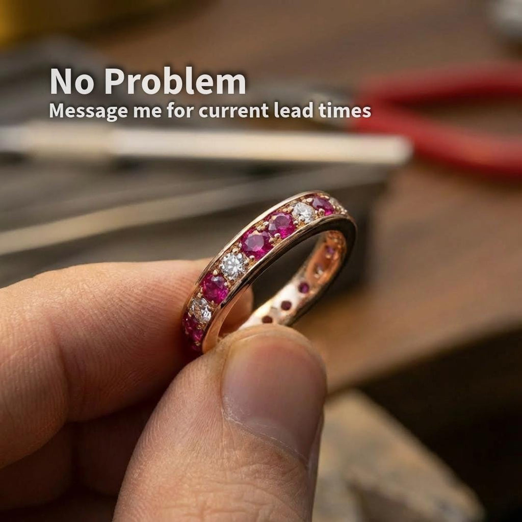 Example of lab grown pink sapphire accent stones set into a finished ring, showing real-world scale and application. 2 mm round cut pink sapphires used as embellishment stones alongside white stones in a custom jewelry setting.
