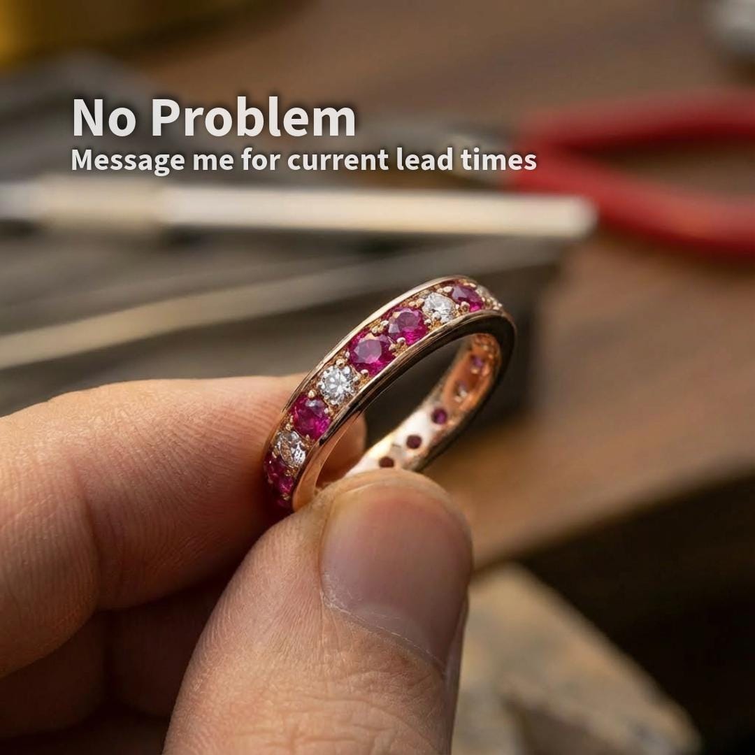 Example of lab grown pink sapphire accent stones set into a finished ring, showing real-world scale and application. 2 mm round cut pink sapphires used as embellishment stones alongside white stones in a custom jewelry setting.
