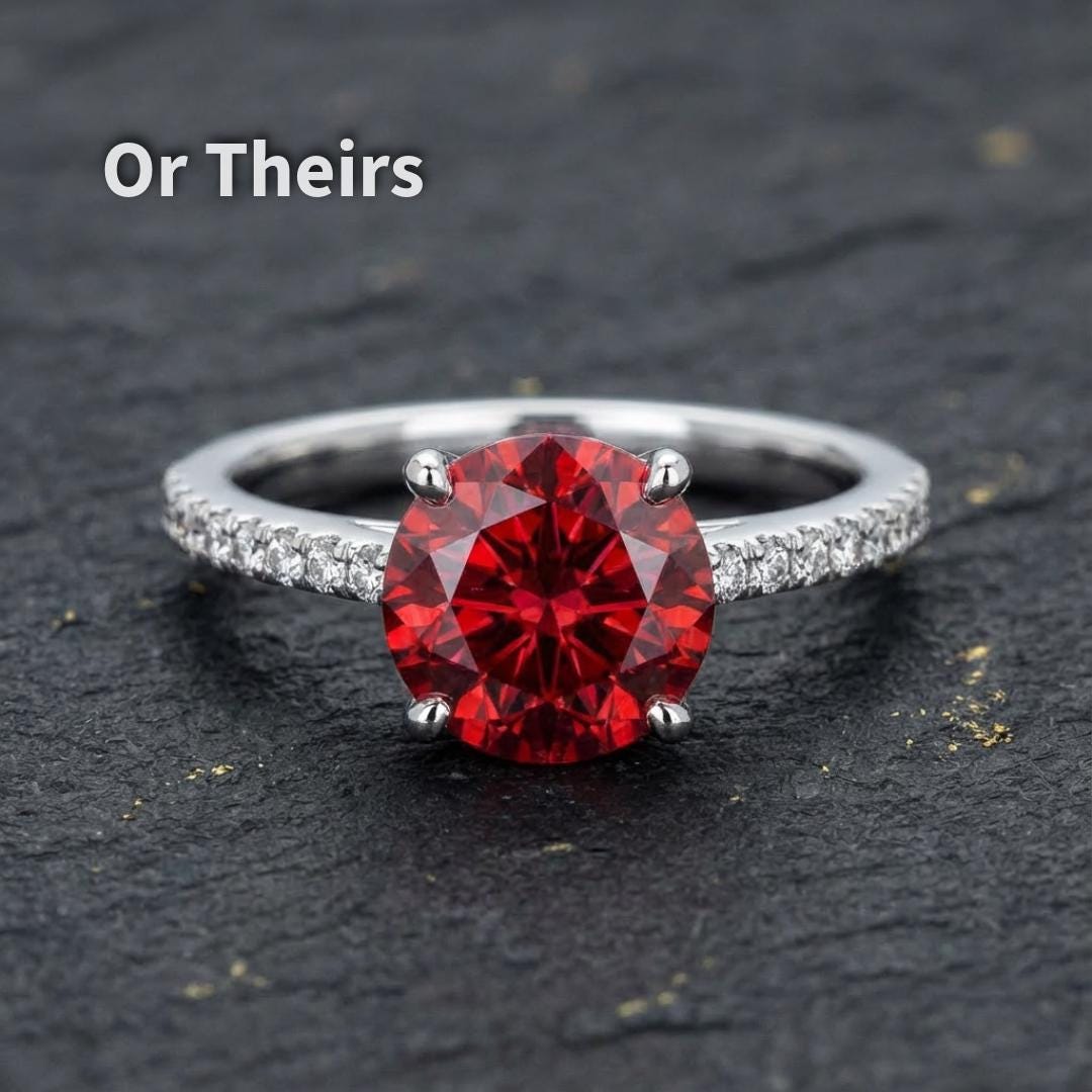 1 carat ruby moissanite set in a white metal ring, featuring a round Russian brilliant cut center stone