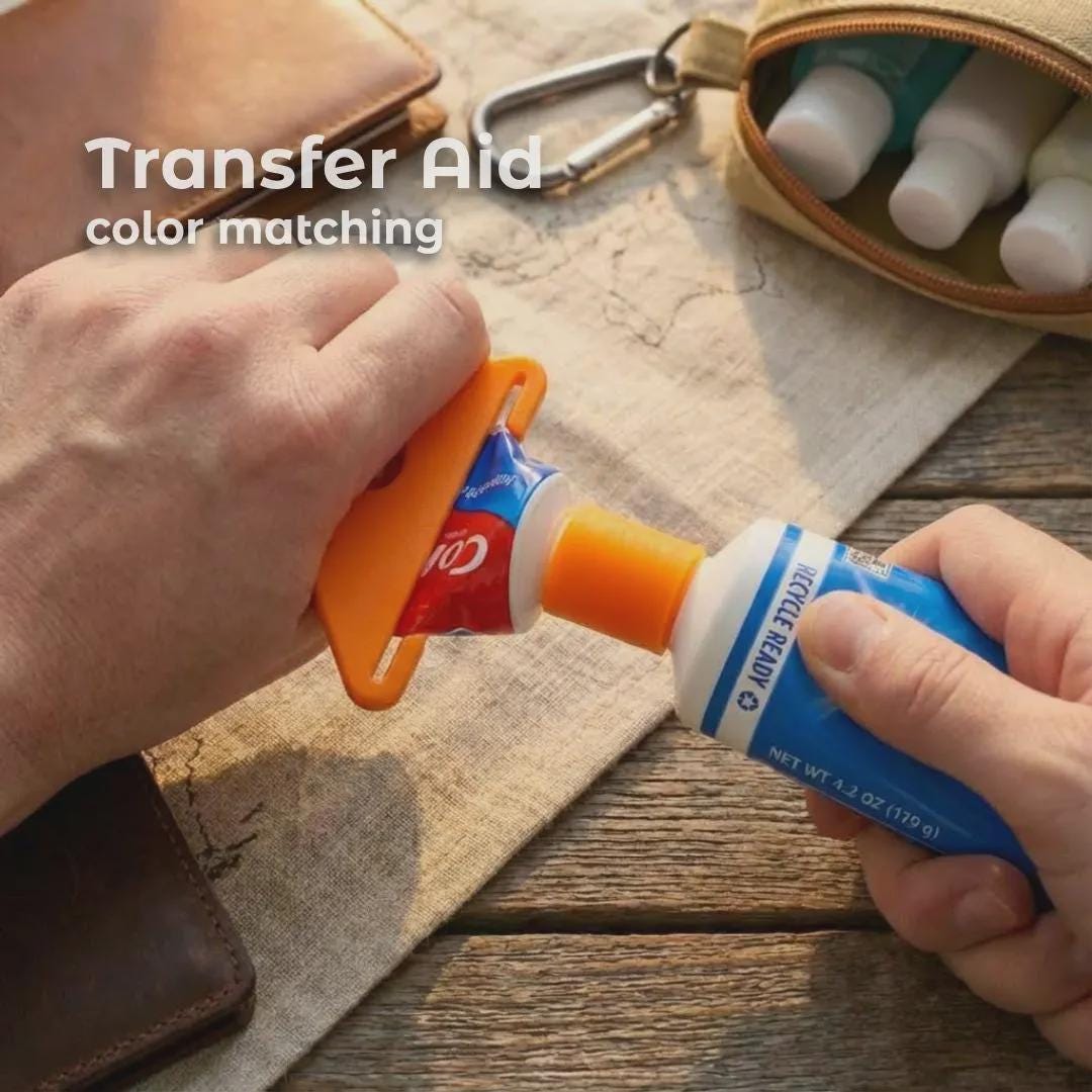 “Close-up of a hand using an orange toothpaste transfer aid squeezer to push toothpaste from a full-size Crest tube into a Colgate travel tube through a matching refill adapter. A travel pouch and small toiletry bottles are visible in the background. The image highlights how the tool provides clean, controlled transfers for camping and travel hygiene kits.”