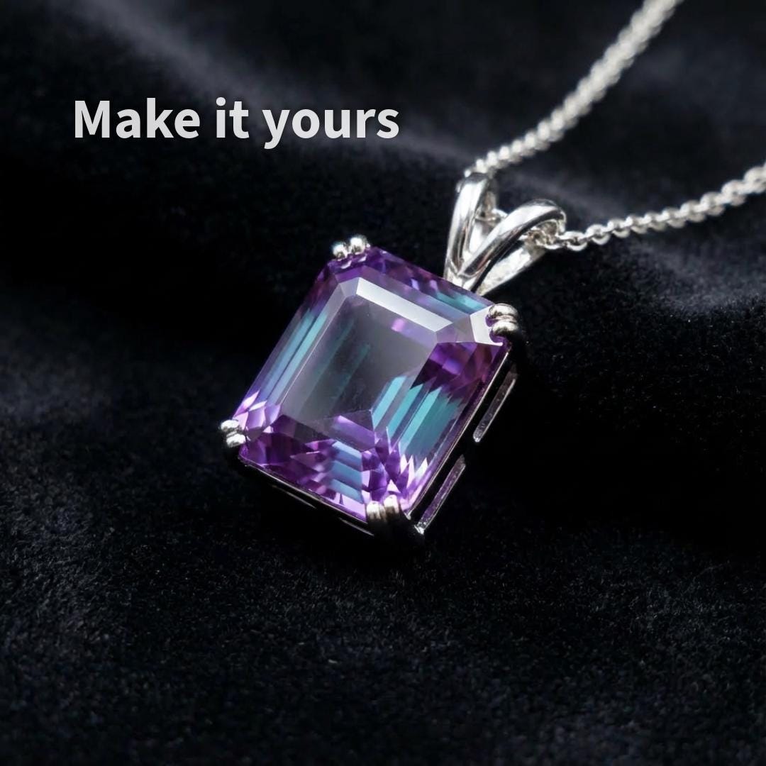 Loose alexandrite sapphire gemstone, 6 carat Asscher cut, resting on black fabric
