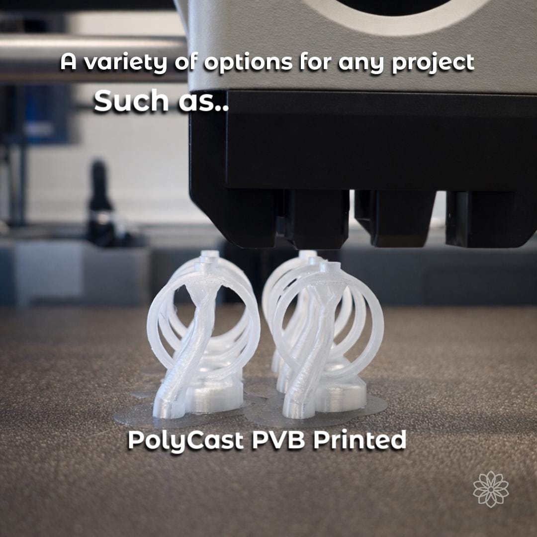 Two transparent PolyCast PVB ring blanks printed on a build plate, shown directly beneath a desktop 3D printer toolhead. The ring blanks include integrated sprues and internal supports, illustrating how FDM printed casting patterns are produced for clean burnout and metal casting. The image highlights accessibility and repeatability for makers using printed patterns instead of traditional wax carving.