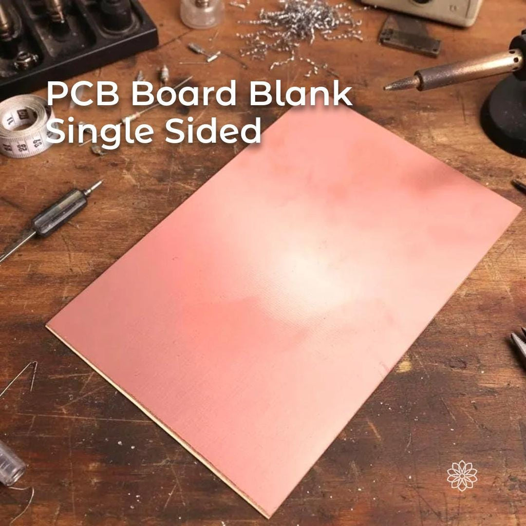 “A large copper-clad PCB blank placed on a workbench with a soldering iron, cutters, and scattered components nearby. The copper surface shows a light brushed texture typical of raw laminate prepared for PCB etching, CNC isolation routing, circuit prototyping, and electronics projects.”