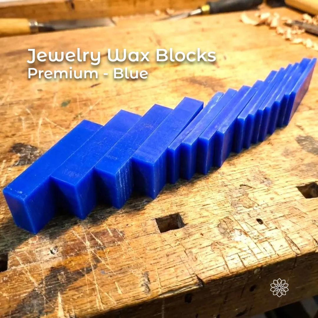 Blue jeweler’s wax bars lined up in increasing sizes on a wooden bench. Used for hand-carved jewelry models, prototype ring forms, engraving practice, and creating detailed lost-wax casting patterns with gravers or rotary tools.