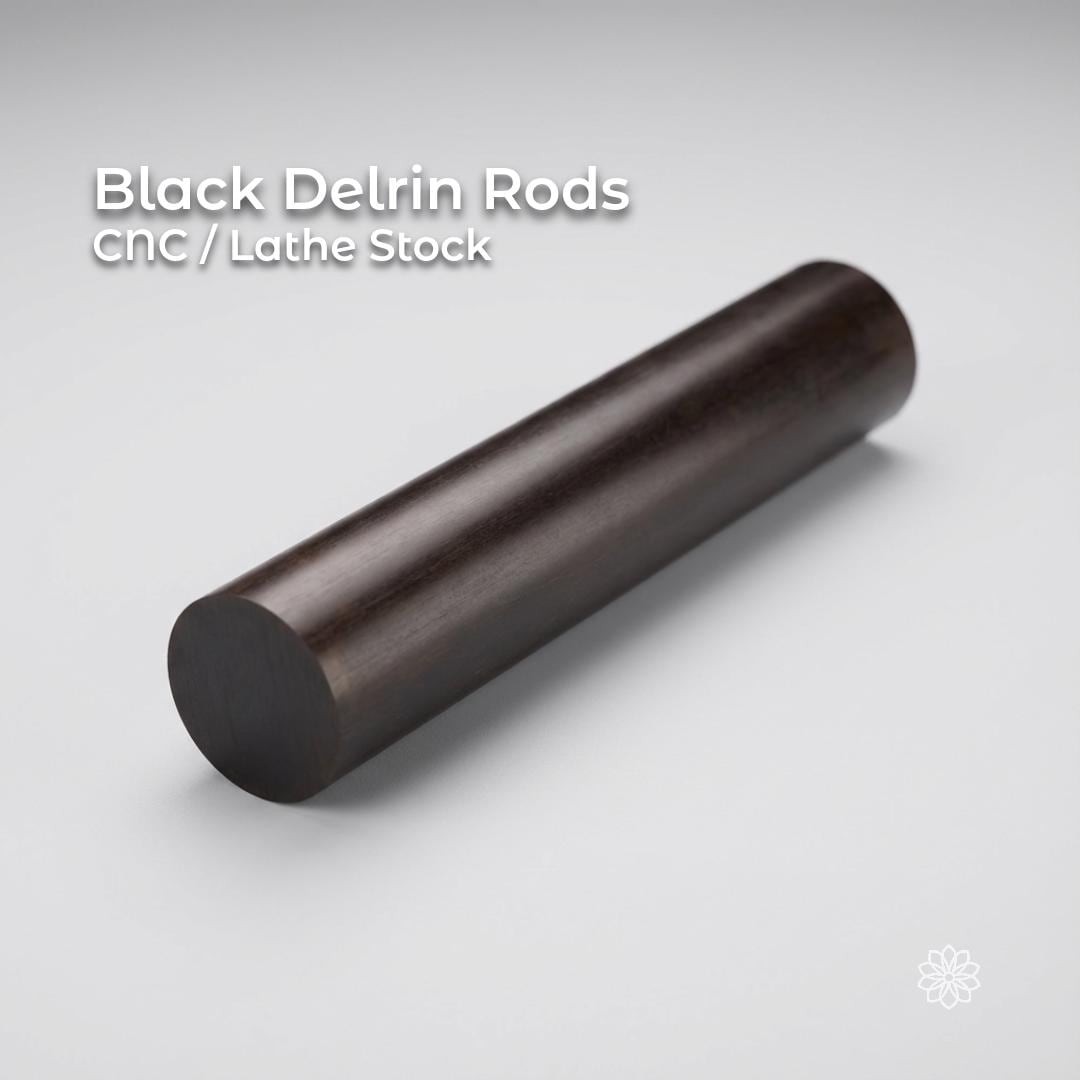 Black Delrin acetal rod shown on a clean white background, labeled CNC and lathe stock. Solid round engineering plastic rod with smooth surface finish, used for machining bushings, spacers, fixtures, and low-friction mechanical parts on CNC mills or lathes.