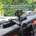 Dash-mounted accessory rail installed on a Jeep Gladiator dashboard, featuring a black aluminum extrusion rail secured with custom carbon fiber–reinforced 3D printed brackets. An action camera is mounted on an adjustable arm above the dash, with a phone ball mount visible. The rail sits flush in the factory dash recess and provides stable mounting for driving and off-road use.