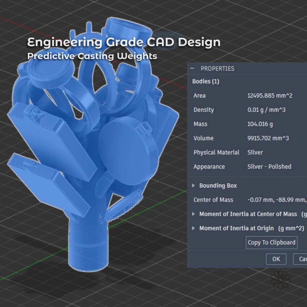 A CAD workspace showing a blue wireframe digital model of multiple ring blanks & pendants attached to a sprue tree. On-screen property panels display calculated volume, mass, and material settings for silver casting. This image represents engineering-grade design work used to predict casting weight, material usage, and physical behavior before fabrication begins.