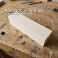 A rectangular epoxy tooling block sitting on a woodworking bench