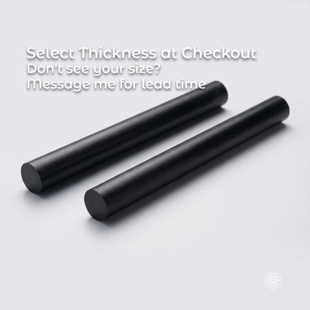Two black 10mm Delrin acetal rods displayed side by side on a white background, indicating size selection at checkout. Precision plastic rod stock for CNC machining and lathe work, commonly used for bushings, wear parts, spacers, guides, and prototype components.