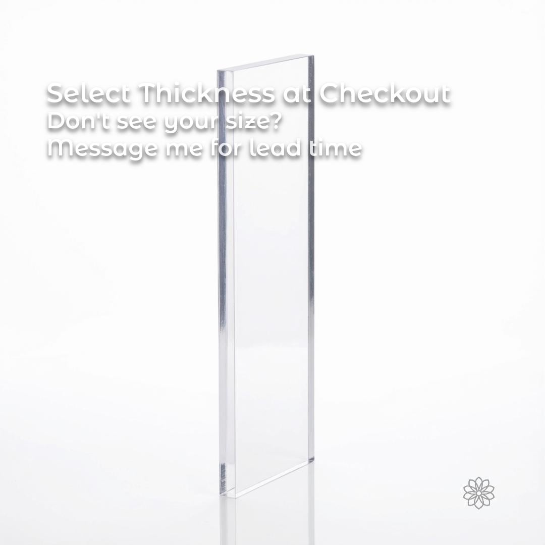 Clear polycarbonate sheet displayed vertically on a white background to emphasize material thickness and edge profile