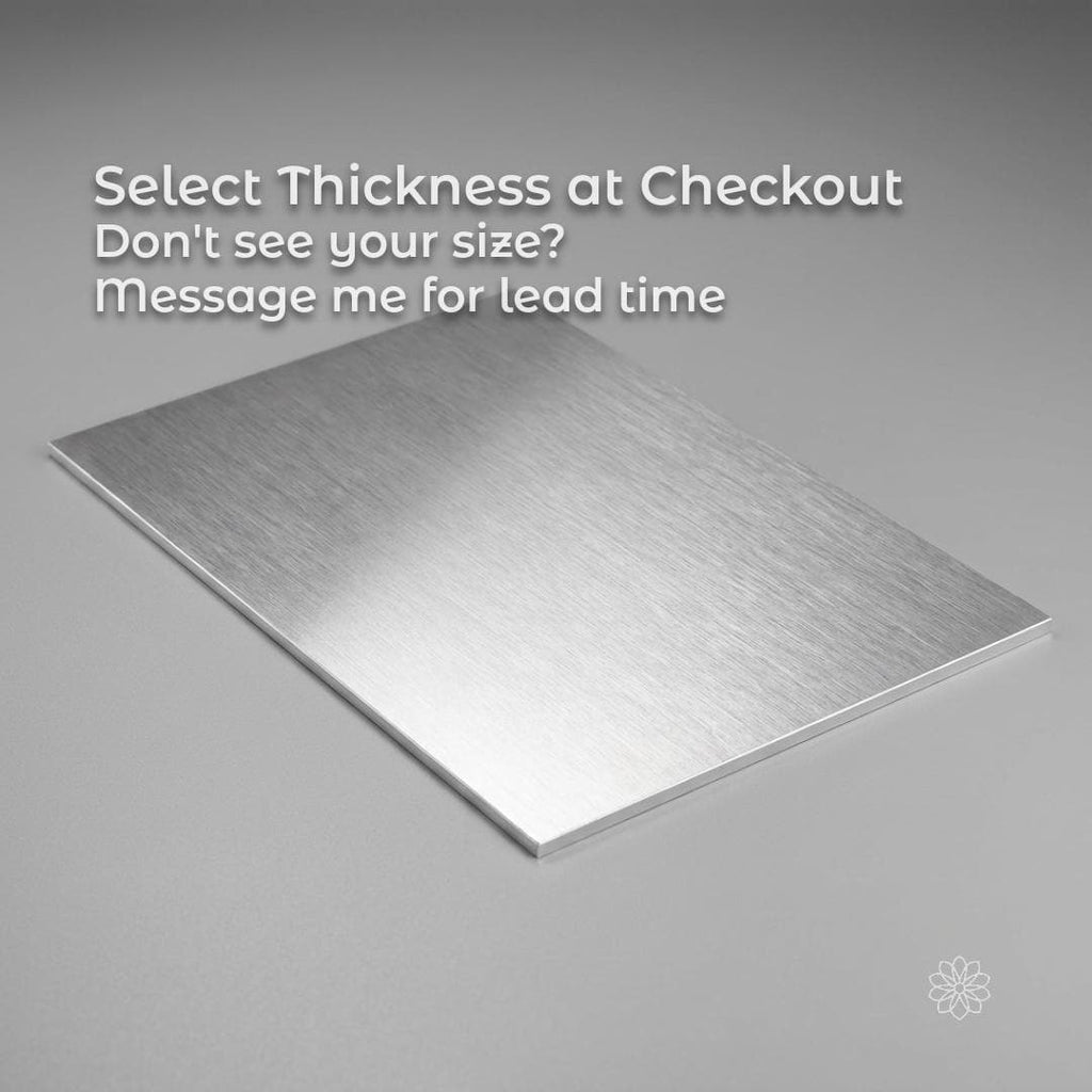 6061 Aluminum Plate CNC sheet stock shown as a thinner brushed aluminum sheet on a gray background, angled to show flatness and surface finish, representing selectable thickness options for CNC machining, fixtures, and small-batch fabrication.