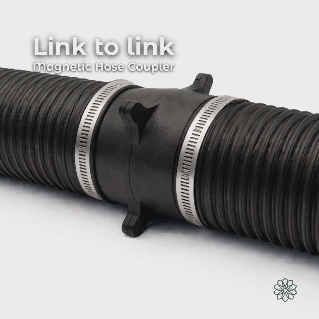 Vent Link Link-to-Link magnetic hose coupler installed between two 4-inch flexible diesel heater hoses, extending duct length without rerouting the system. The carbon fiber reinforced polycarbonate coupler uses embedded locking magnets to maintain alignment while allowing quick separation for layout changes. On-image text reads “Link to link magnetic hose coupler.”