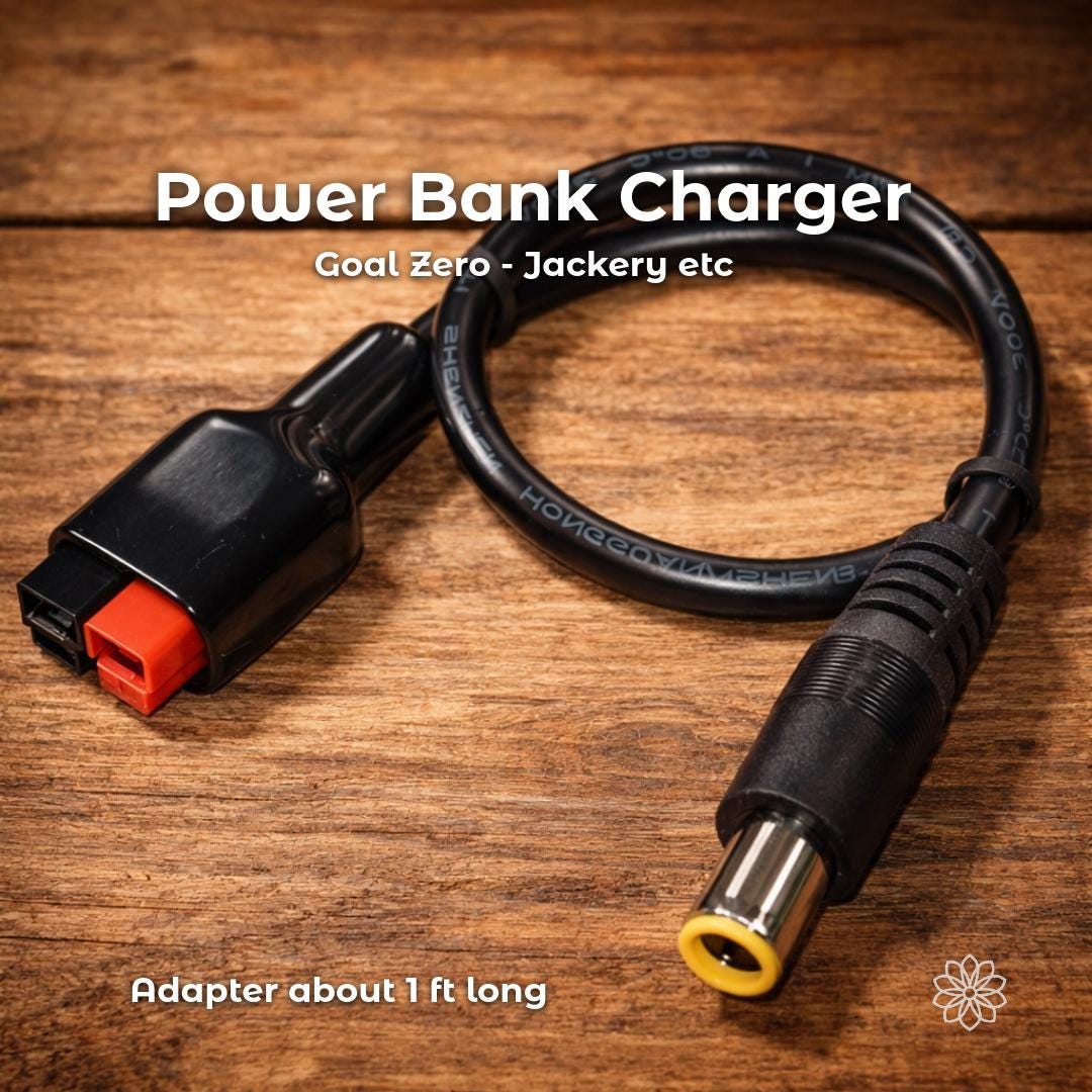 Anderson Powerpole to DC barrel plug adapter cable used for charging portable power stations such as Goal Zero or Jackery units. The short cable is shown on a wooden surface with clearly visible connector types. On-image text reads “Power Bank Charger,” “Goal Zero etc,” and “Adapter about 1 ft long.”