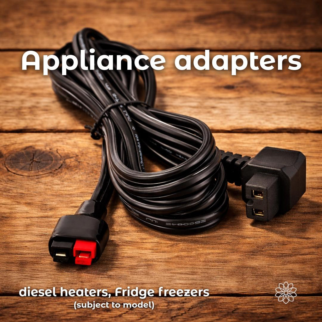 DC appliance adapter cable shown on a wooden surface with an Anderson Powerpole connector on one end and a cigarette lighter style plug on the other. The image includes the text “Appliance adapters” and “diesel heaters, Fridge freezers (subject to model),” indicating compatibility with common 12-volt devices depending on manufacturer and power requirements.