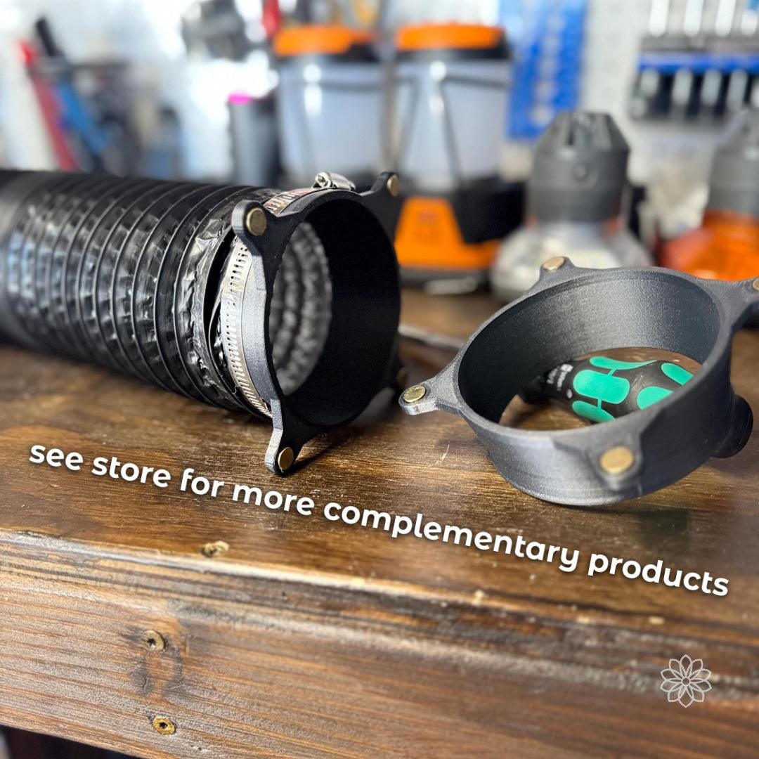 “Close-up of a diesel heater duct setup on a wooden workbench showing a black 4-inch dryer hose attached with a metal clamp and a modular adapter system. A magnetic coupler ring and a secondary adapter ring are placed beside the hose, demonstrating quick-connect compatibility. White on-image text reads ‘See store for more complementary products,’ indicating expandable system components.”