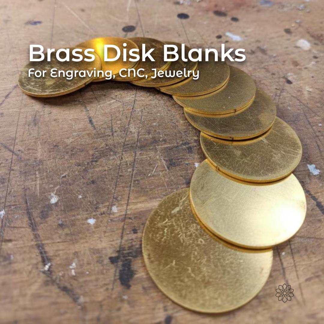 “A curved row of round brass disks laid out on a woodworking bench. Each disk shows light surface scratches typical of raw brass blanks prepared for CNC machining, engraving, or jewelry making. The disks are uniform in diameter and thickness, arranged edge-to-edge to show material consistency and finish.”