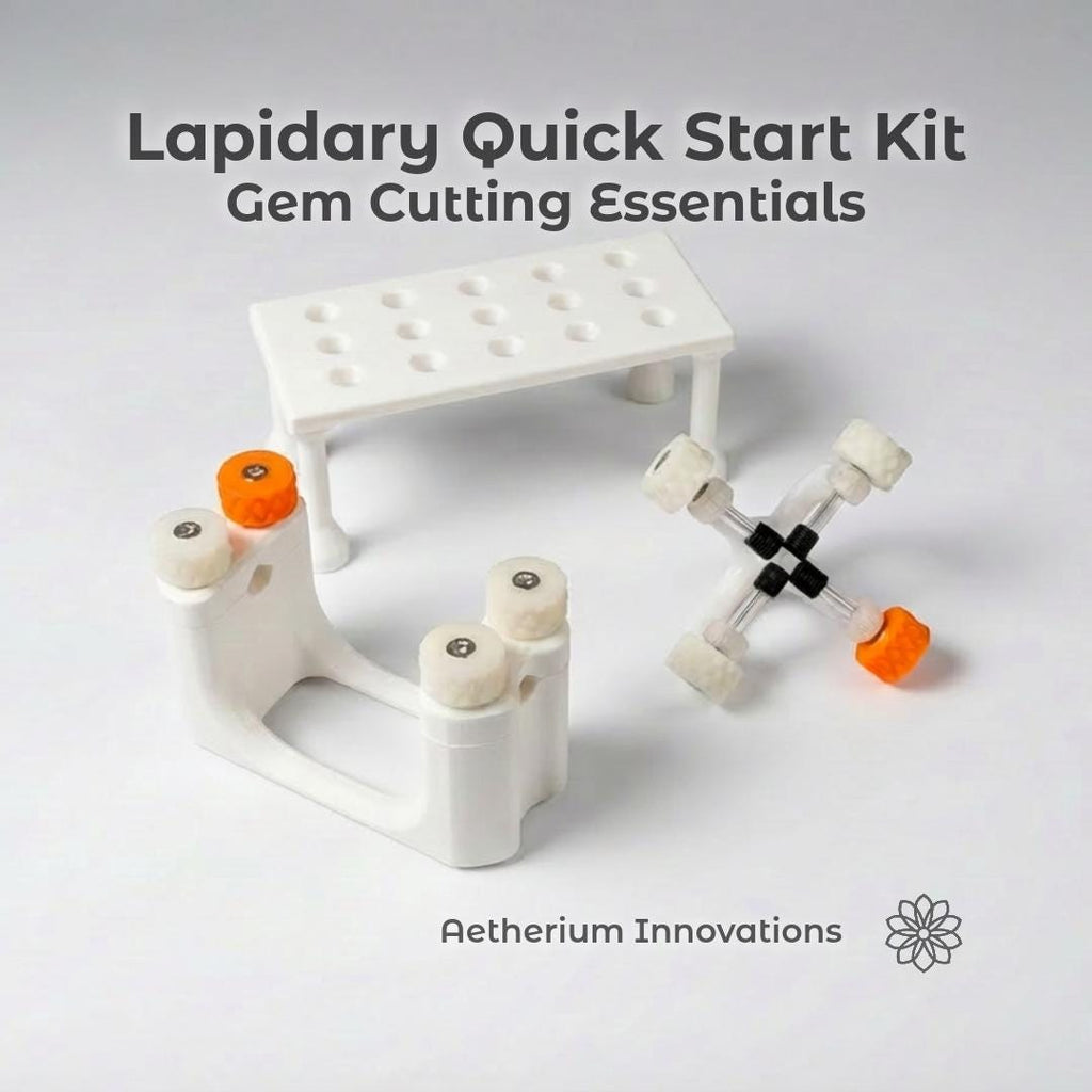 "Components of the Lapidary Gem Cutting & Polishing Kit by Aetherium Innovations. labeled on a wood surface: the Gem Xfer, Gem Axis, and Dop Stick Tray. Each tool features 3D-printed polymer parts with textured knobs for grip. Text overlays identify each part, showing the organized and educational layout ideal for gemstone work."