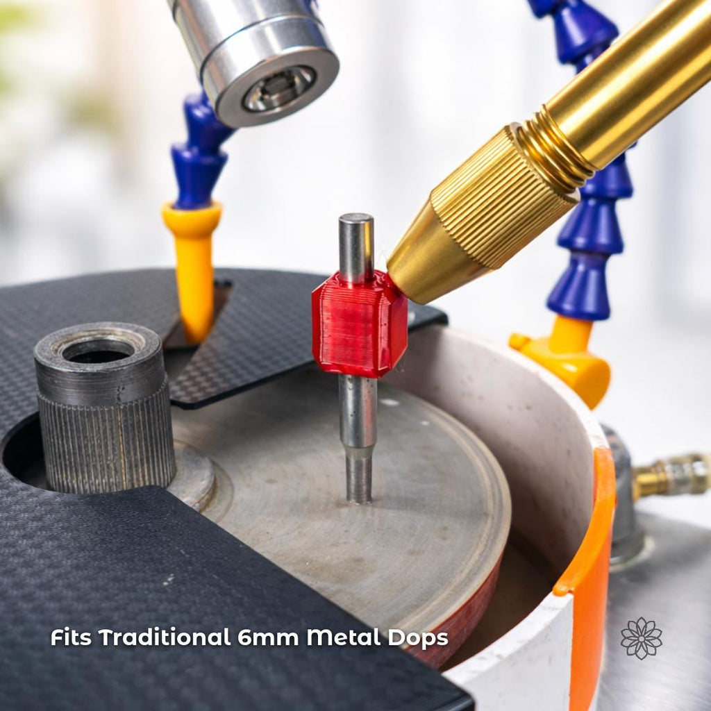 Close view of the Aetherium 45-degree tabling adapter mounted on a traditional 6 mm metal dop above a faceting lap. The red polymer fixture holds the dop vertically while a brass faceting handpiece approaches the tool. Flexible coolant lines and the faceting machine deck are visible. Overlay text reads “Fits Traditional 6mm Metal Dops,” highlighting compatibility with Vevor-style faceting machines.