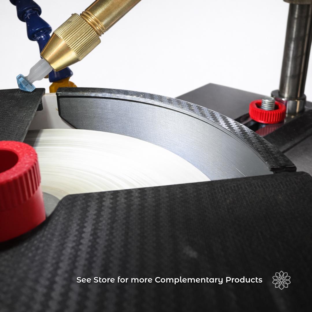 Faceting machine setup with a brass handpiece holding a gemstone dop above a spinning diamond lap and carbon fiber machine components. The image highlights the broader Aetherium lapidary workflow and tool ecosystem. Overlay text reads “See Store For More Complementary Products,” indicating additional faceting tools and accessories available from Aetherium Innovations.