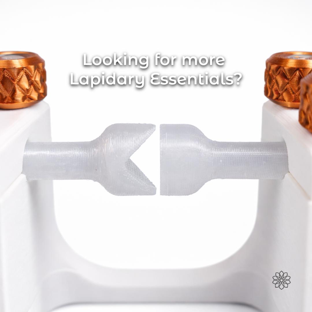 Two translucent lapidary dop stick tip profiles displayed between white holders with copper-colored knurled knobs on a plain background. This supporting image shows complementary faceting accessories from the same lapidary tool ecosystem. Overlay text reads “Looking for more Lapidary Essentials?”