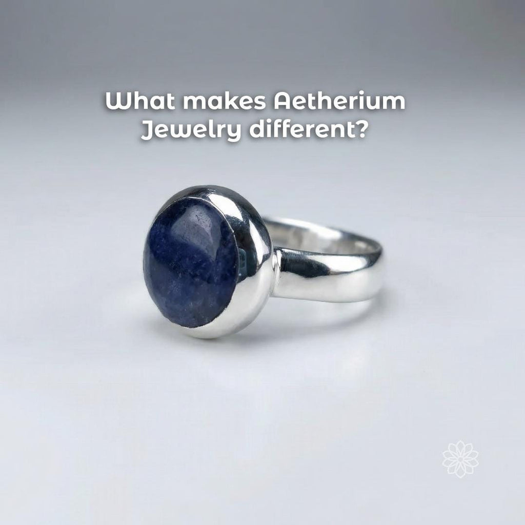 Angled view of a sterling silver bezel-set blue sapphire cabochon ring highlighting the domed stone surface and handmade finish. Text reads “What makes Aetherium Jewelry different?”