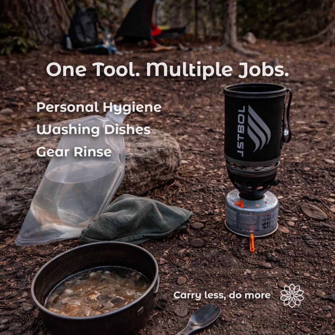 Backcountry campsite showing ultralight bottle bidet cap used for multiple tasks including personal hygiene, dish rinsing, and gear cleaning. Camping stove, pot, and water bottle setup demonstrating multi-use rinse tool for backpacking and ultralight outdoor systems.